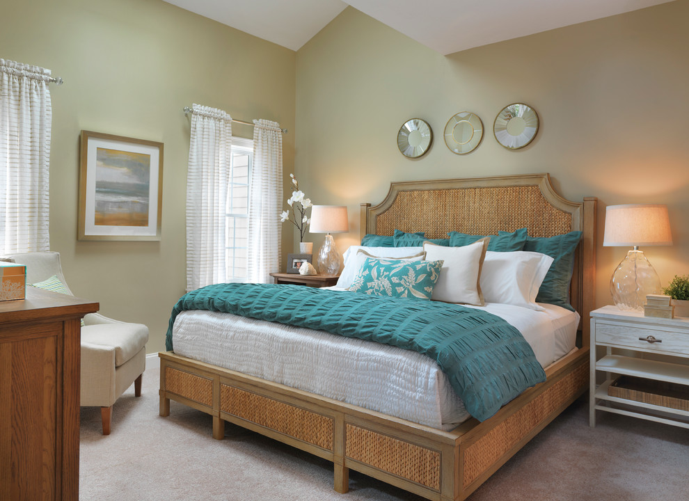 Inspiration for a mid-sized beach style master bedroom in Boston with beige walls and carpet.