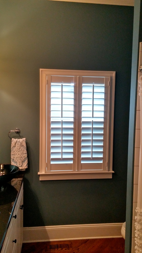 Small traditional bathroom in Charlotte with blue walls.