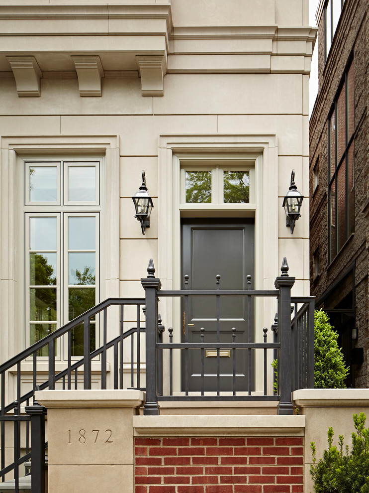 Expansive traditional front door in Chicago with a single front door and a gray front door.