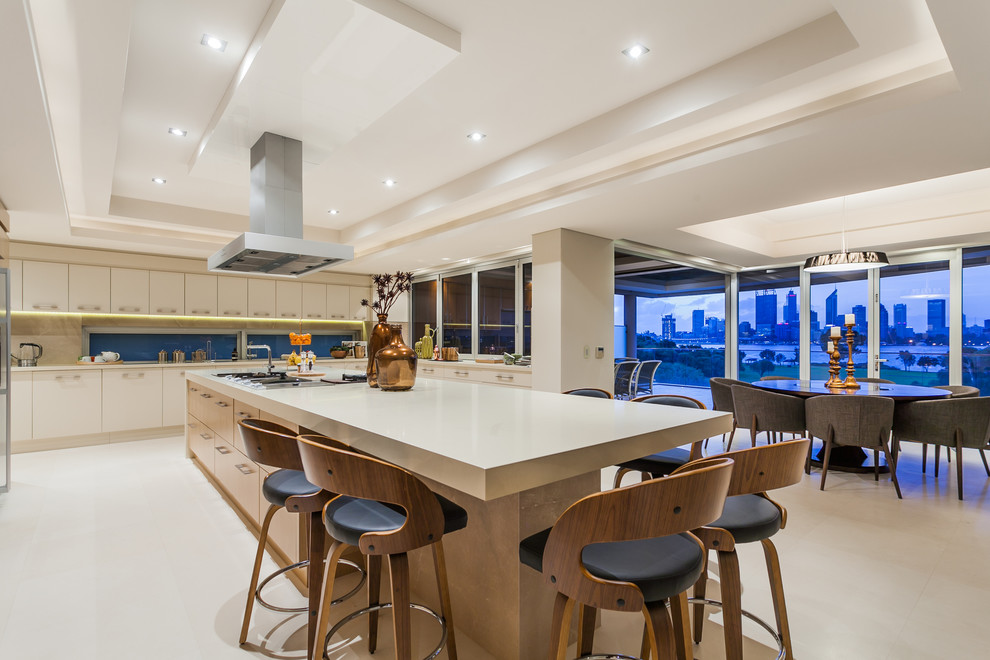 Photo of a contemporary u-shaped open plan kitchen in Perth with flat-panel cabinets, light wood cabinets, stainless steel appliances and with island.