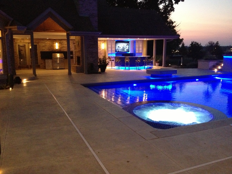 Hot tub - large transitional backyard concrete paver and rectangular natural hot tub idea in Cedar Rapids