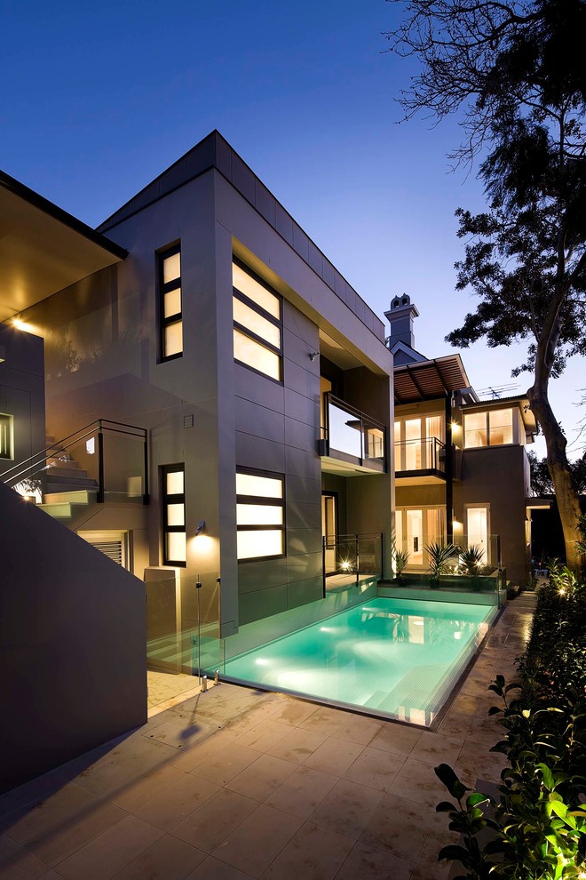 This is an example of a contemporary backyard rectangular pool in Sydney.
