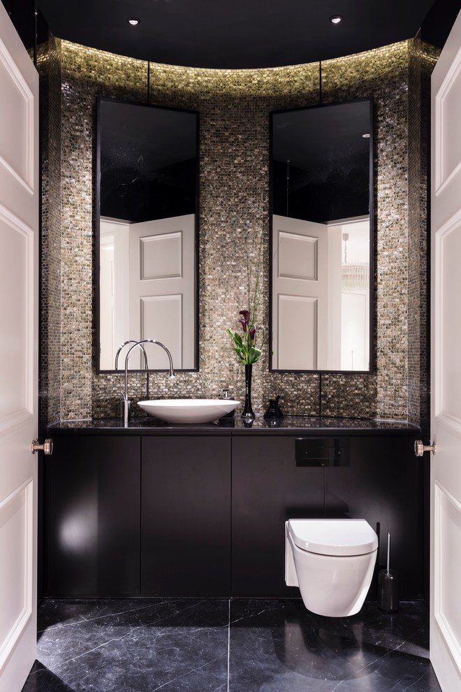 Design ideas for a large contemporary powder room in Surrey with flat-panel cabinets, black cabinets, a wall-mount toilet, mosaic tile, marble floors, marble benchtops, black floor, a vessel sink, black benchtops and multi-coloured tile.