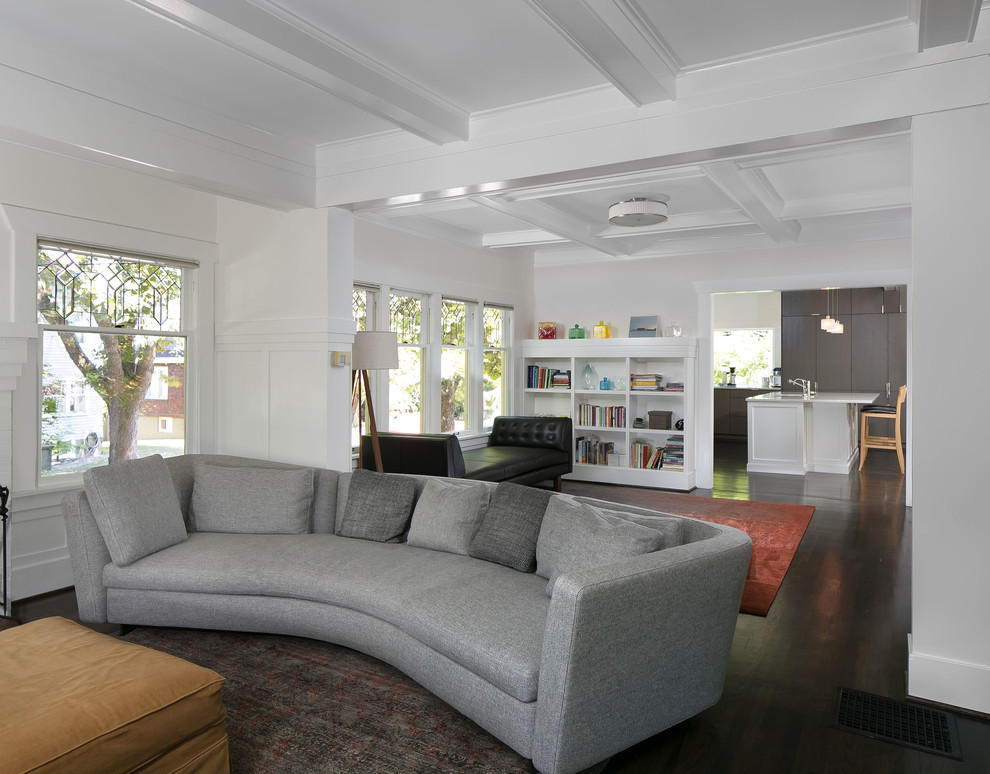 Design ideas for a traditional living room in Seattle with white walls, dark hardwood floors, brown floor and coffered.