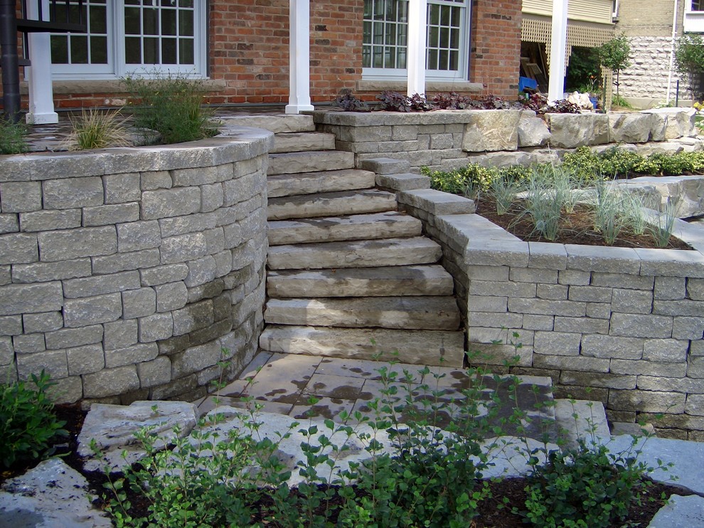 This is an example of a country concrete curved staircase in Toronto with concrete risers.
