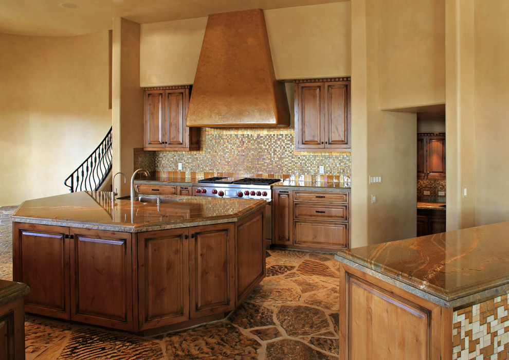 Example of a large mountain style slate floor and brown floor kitchen design in Phoenix with an undermount sink, raised-panel cabinets, dark wood cabinets, granite countertops, multicolored backsplash, mosaic tile backsplash and an island