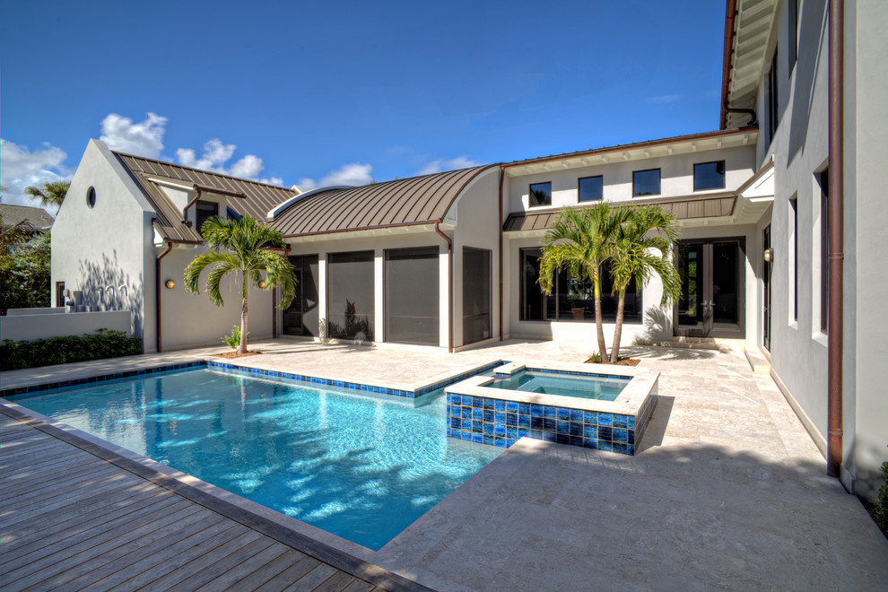 Tropical pool in Miami with decking.