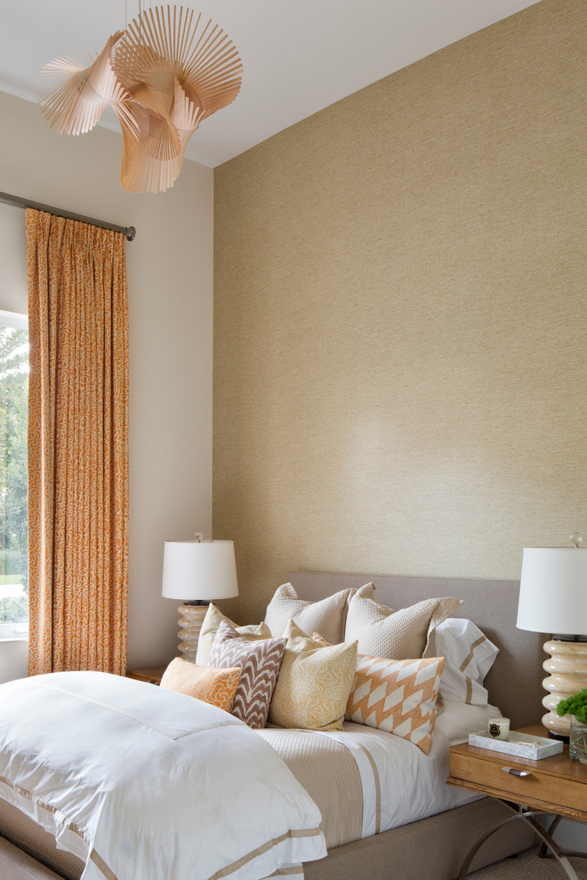 Inspiration for a mid-sized contemporary guest bedroom in Miami with beige walls and carpet.