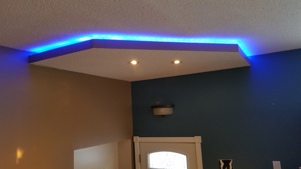 Example of a small minimalist foyer design with blue walls and a white front door