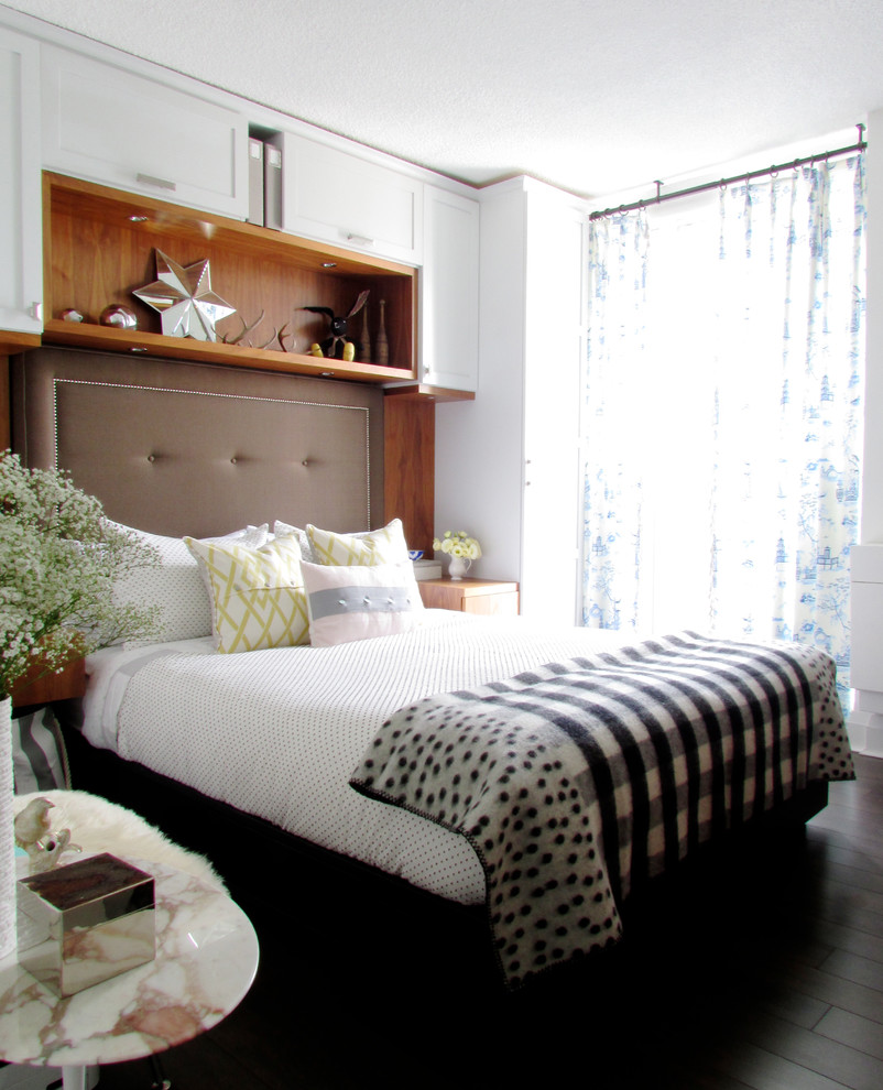 Inspiration for a contemporary bedroom in Toronto with dark hardwood floors.