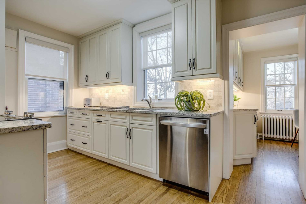 Example of a transitional kitchen design in Toronto