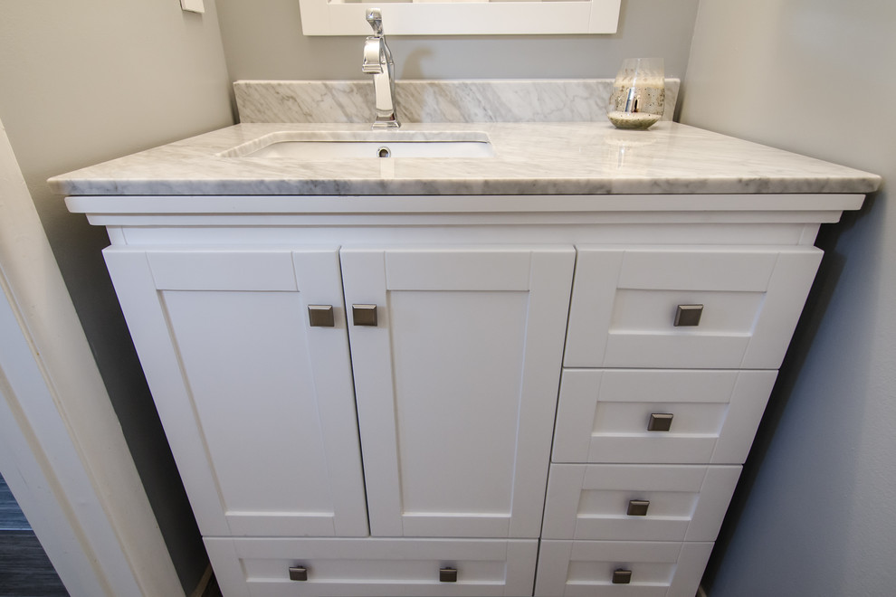 Example of a small transitional gray tile and porcelain tile porcelain tile home design design in DC Metro with an undermount sink, shaker cabinets, a two-piece toilet and gray walls