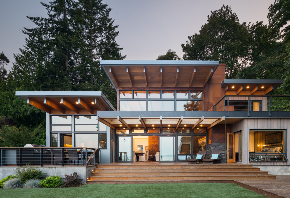 Large contemporary two-storey brown house exterior in Seattle with a flat roof.