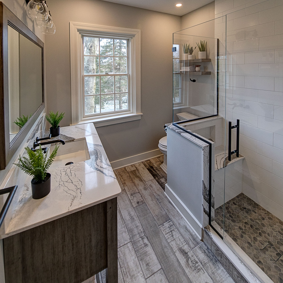 Design ideas for a small country master bathroom in Other with flat-panel cabinets, medium wood cabinets, white tile, cement tile, porcelain floors, engineered quartz benchtops, grey floor, white benchtops, a shower seat, a single vanity and a freestanding vanity.