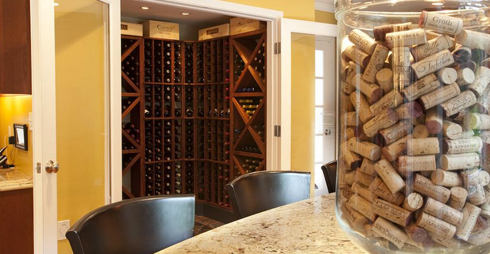 Inspiration for a large transitional wine cellar in Boston with medium hardwood floors and storage racks.