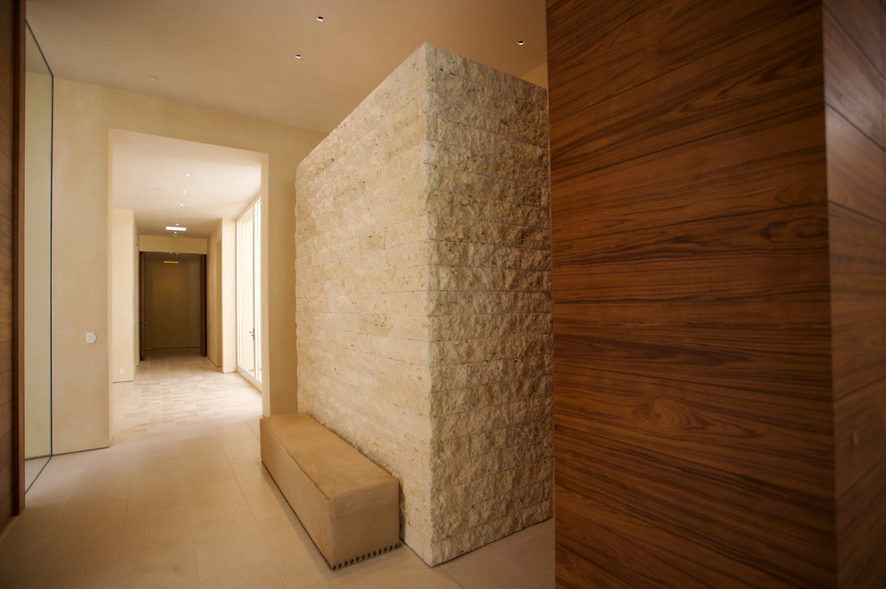 Inspiration for a large contemporary front door in San Francisco with beige walls, travertine floors, a double front door and a medium wood front door.