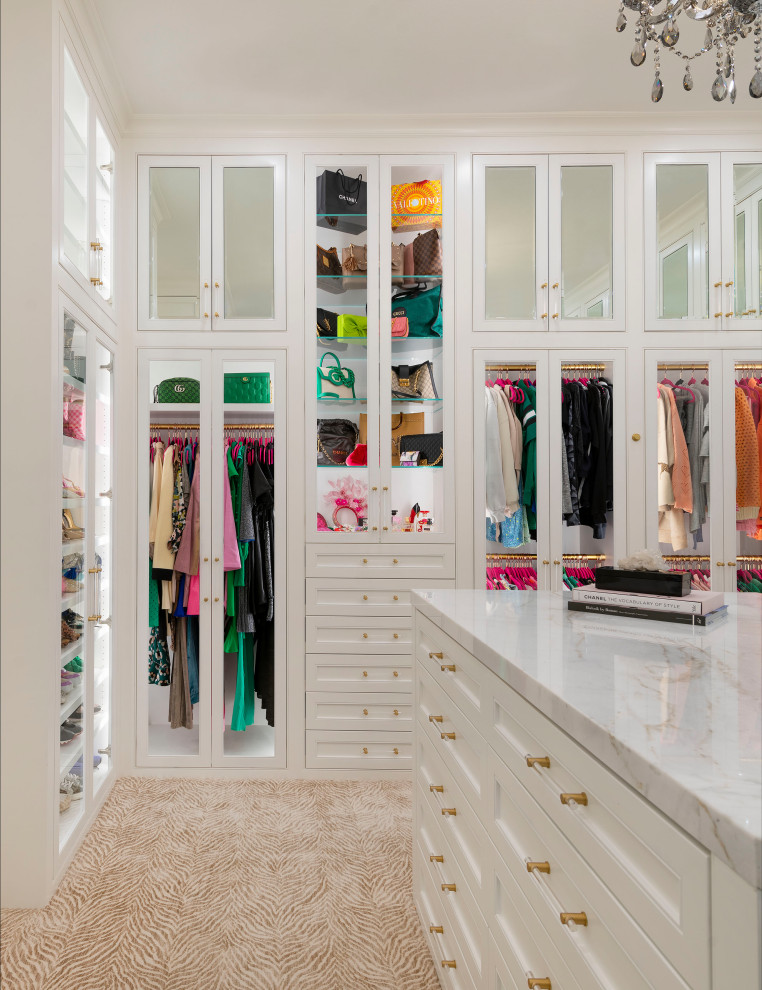 Inspiration for a large transitional gender-neutral walk-in wardrobe in Dallas with beaded inset cabinets, white cabinets, carpet and beige floor.