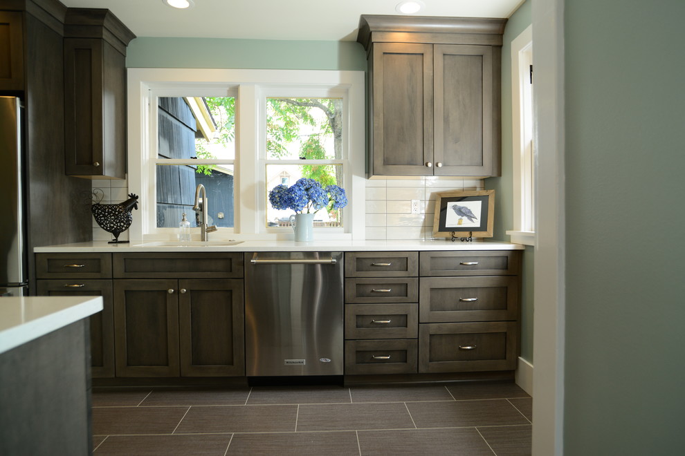 Kitchen pantry - mid-sized transitional galley vinyl floor kitchen pantry idea in Seattle with an undermount sink, shaker cabinets, white cabinets, quartz countertops, white backsplash, cement tile backsplash, stainless steel appliances and no island