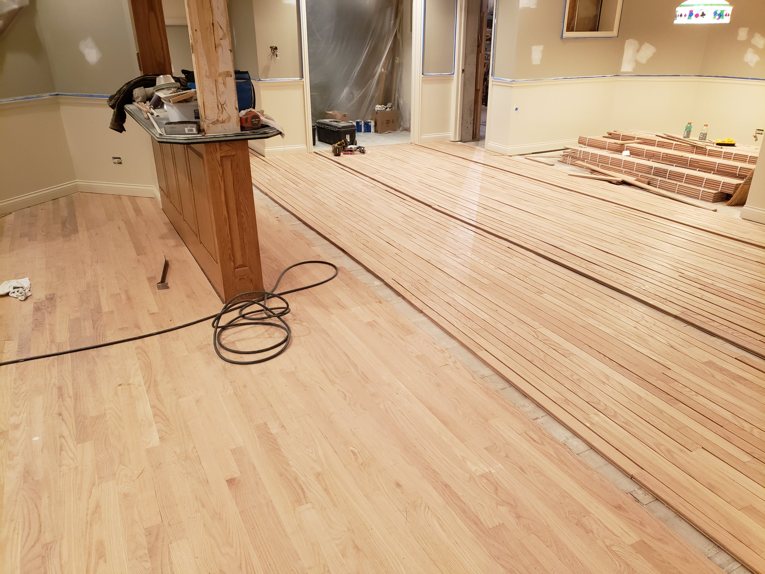 Mount Prospect,  2 and 1/4 red oak installed over radiant heat 3 coats Bona Mega