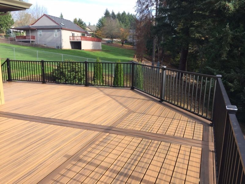 This is an example of a large transitional backyard deck in Charlotte with no cover.