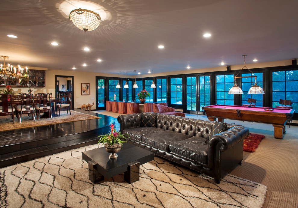 Inspiration for a contemporary open concept carpeted family room remodel in Los Angeles with beige walls