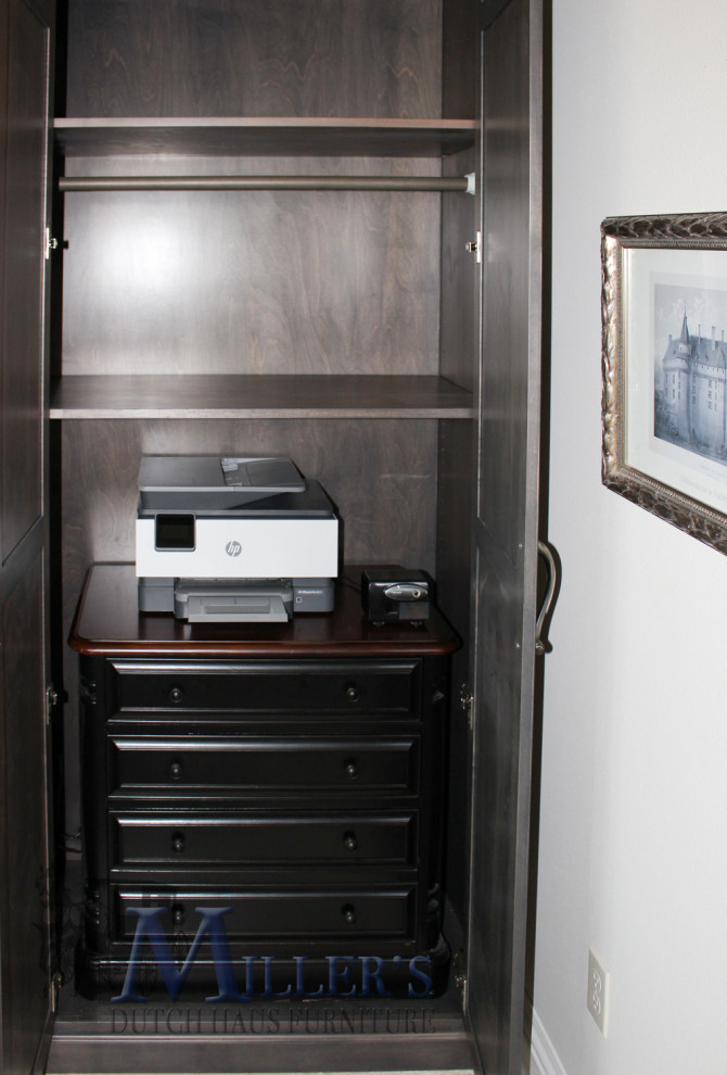 This is an example of a large transitional home office in Tampa with beige walls, carpet and grey floor.