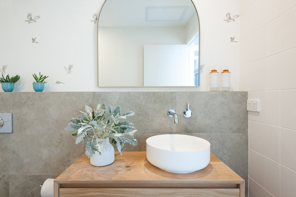 Inspiration for a beach style bathroom in Central Coast with a floating vanity.