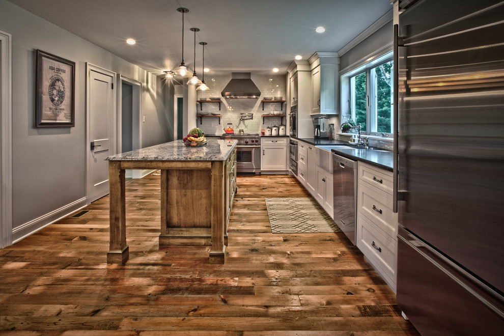 Photo of a country kitchen in Other with dark hardwood floors.