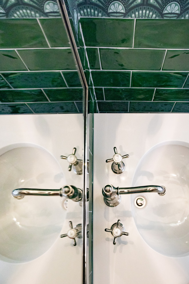 Example of a mid-sized transitional green tile and ceramic tile mosaic tile floor, multicolored floor and wallpaper powder room design with a one-piece toilet, green walls, an undermount sink, solid surface countertops and white countertops