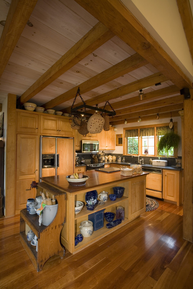 Photo of a traditional l-shaped kitchen in Providence with medium wood cabinets.