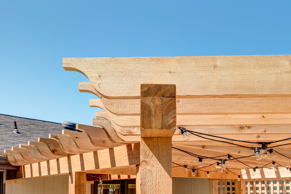 Deck - large transitional backyard deck idea in Chicago with a pergola