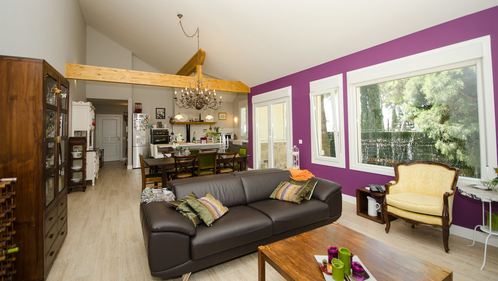 This is an example of a mid-sized eclectic open concept living room in Other with purple walls, ceramic floors and a freestanding tv.