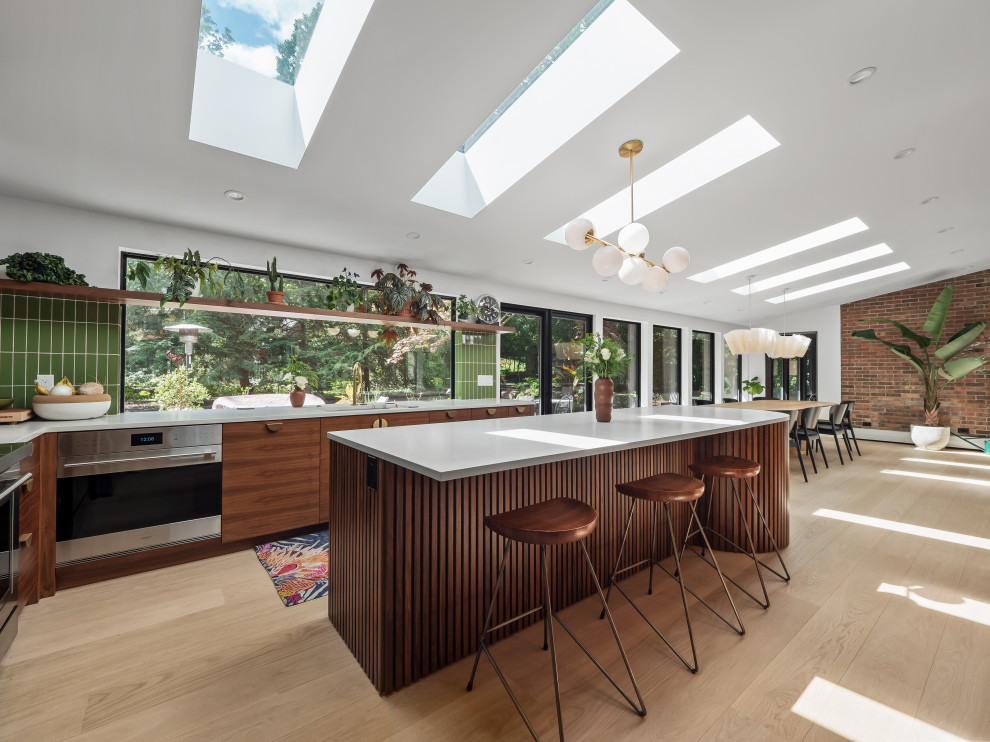 Example of a mid-century modern kitchen design in Detroit