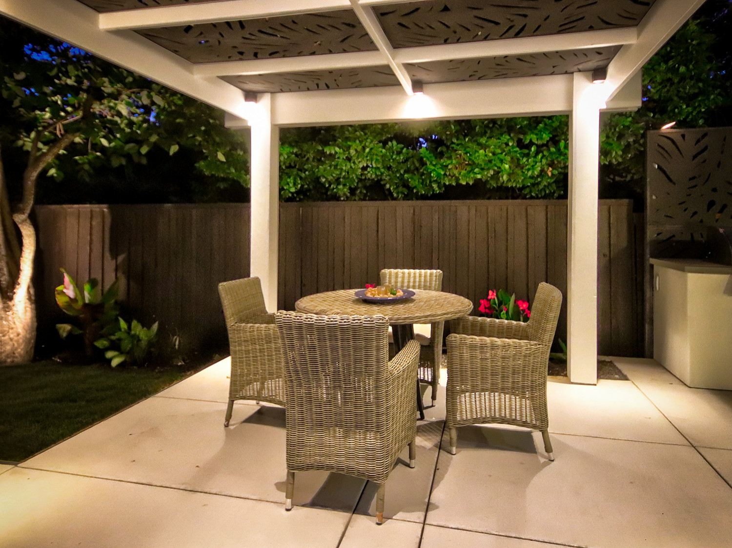 Intimate Nighttime Dining Under the Pergola