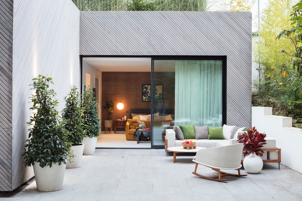 Photo of a large contemporary patio in London.