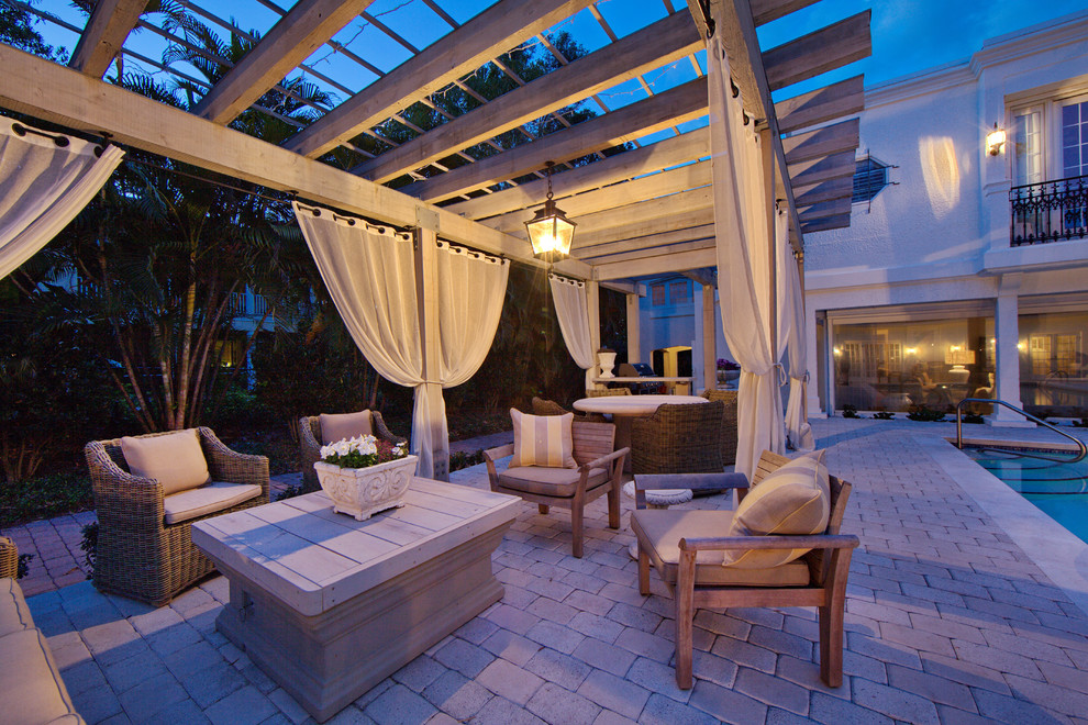 Design ideas for a mediterranean patio in Tampa with a gazebo/cabana.
