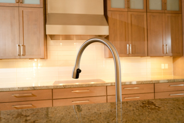 Kitchen - contemporary kitchen idea with shaker cabinets, granite countertops, beige countertops, beige backsplash and subway tile backsplash