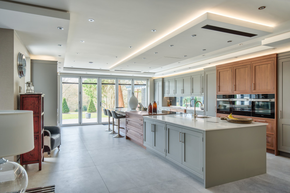 This is an example of a large traditional single-wall kitchen/diner in Sussex with an island.