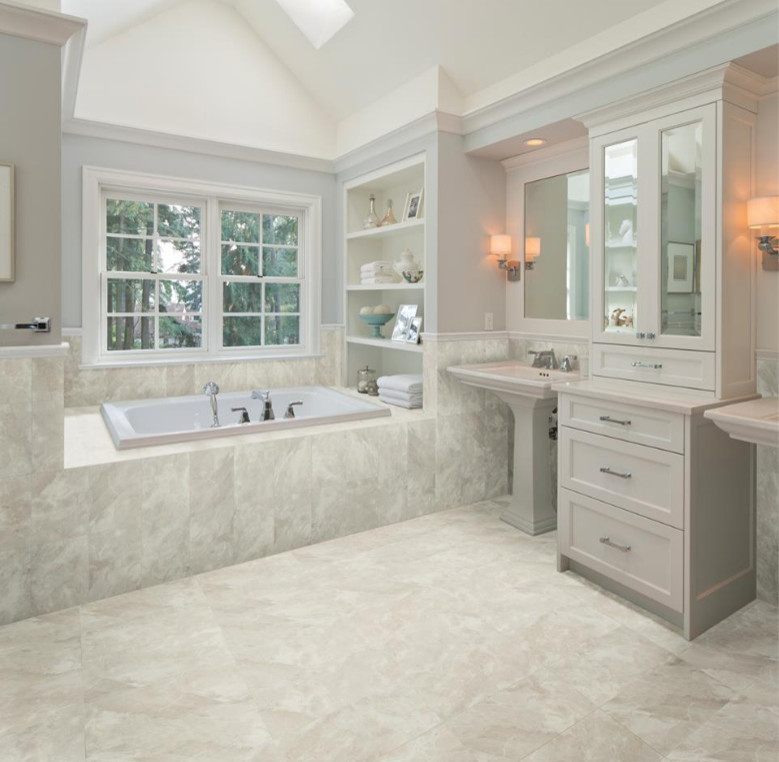 Inspiration for a large transitional master vinyl floor drop-in bathtub remodel in Indianapolis with shaker cabinets, gray cabinets, gray walls, a pedestal sink and wood countertops