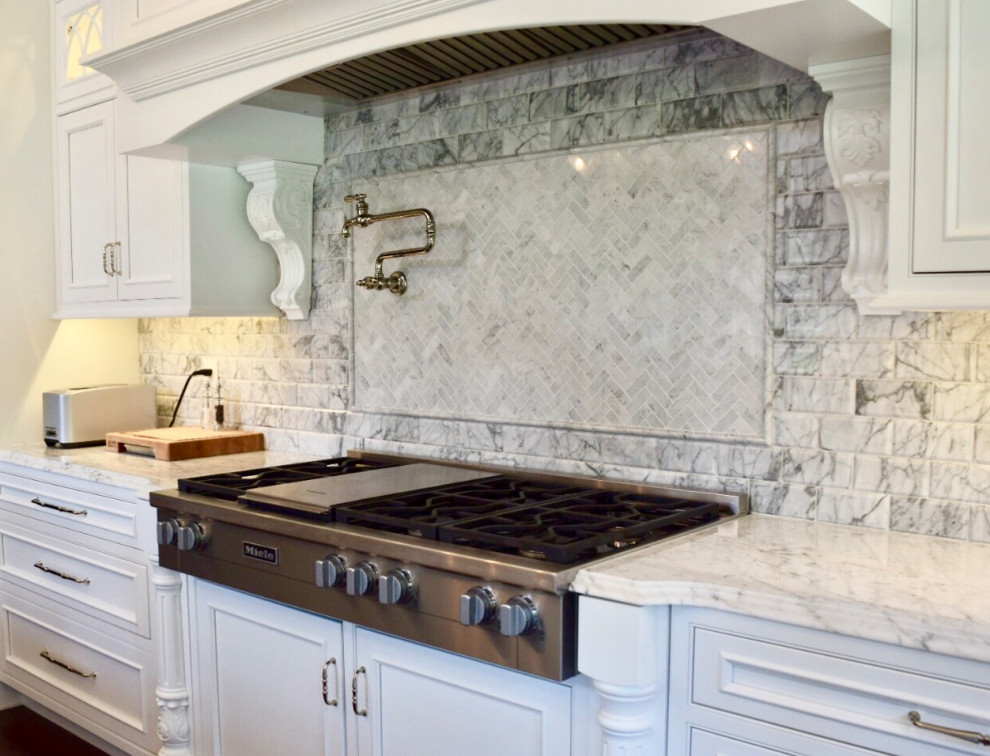 Large traditional u-shaped separate kitchen in Philadelphia with a farmhouse sink, beaded inset cabinets, white cabinets, marble benchtops, grey splashback, marble splashback, panelled appliances, dark hardwood floors, with island, brown floor and grey benchtop.