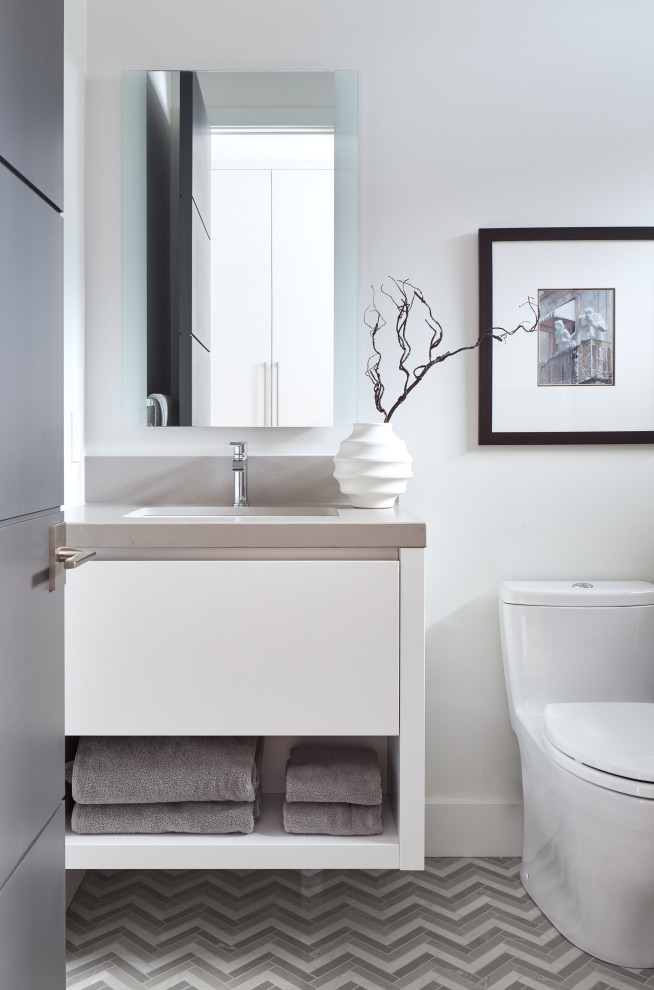 This is an example of a medium sized contemporary bathroom in Toronto with flat-panel cabinets, white cabinets, a submerged sink, engineered stone worktops, multi-coloured floors, grey worktops, a single sink and a floating vanity unit.