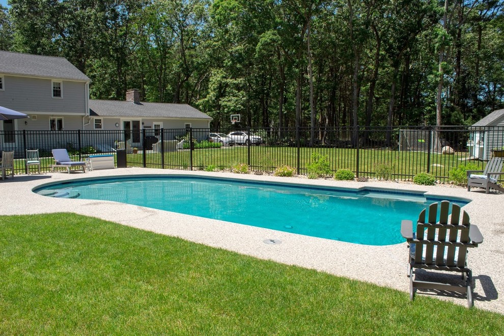 Mid-sized transitional backyard custom-shaped and decomposed granite lap pool house photo in Boston