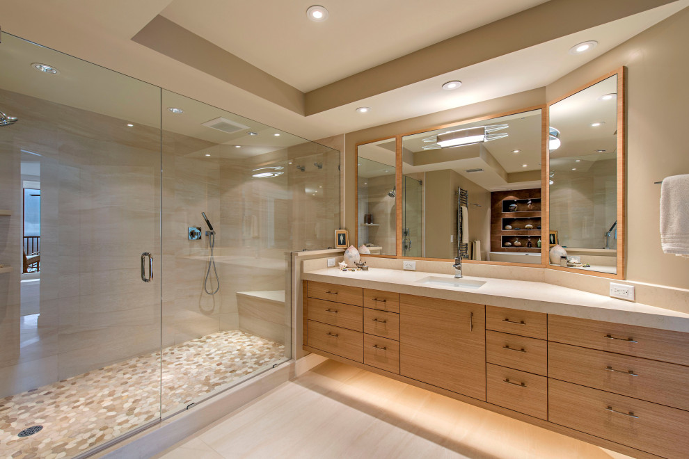 Design ideas for a large contemporary master bathroom in Other with flat-panel cabinets, medium wood cabinets, an alcove shower, beige tile, beige walls, an undermount sink, beige floor, a hinged shower door and beige benchtops.