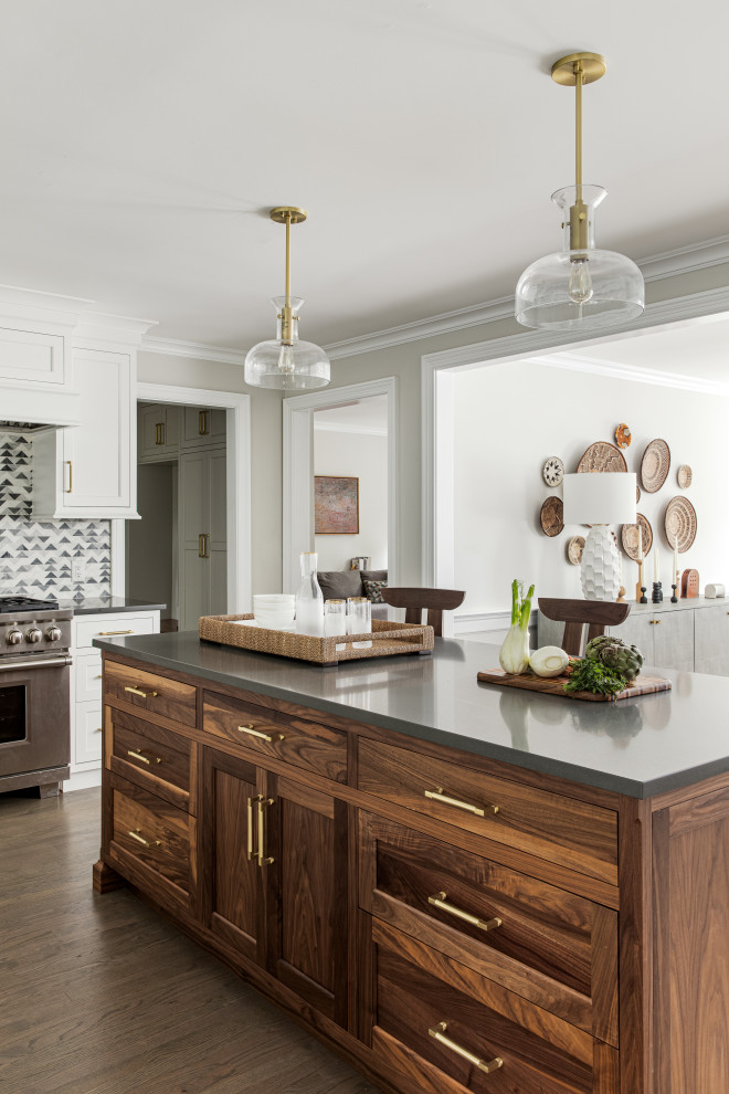 Design ideas for a transitional kitchen in New York with shaker cabinets, white cabinets, medium hardwood floors, with island, brown floor and grey benchtop.