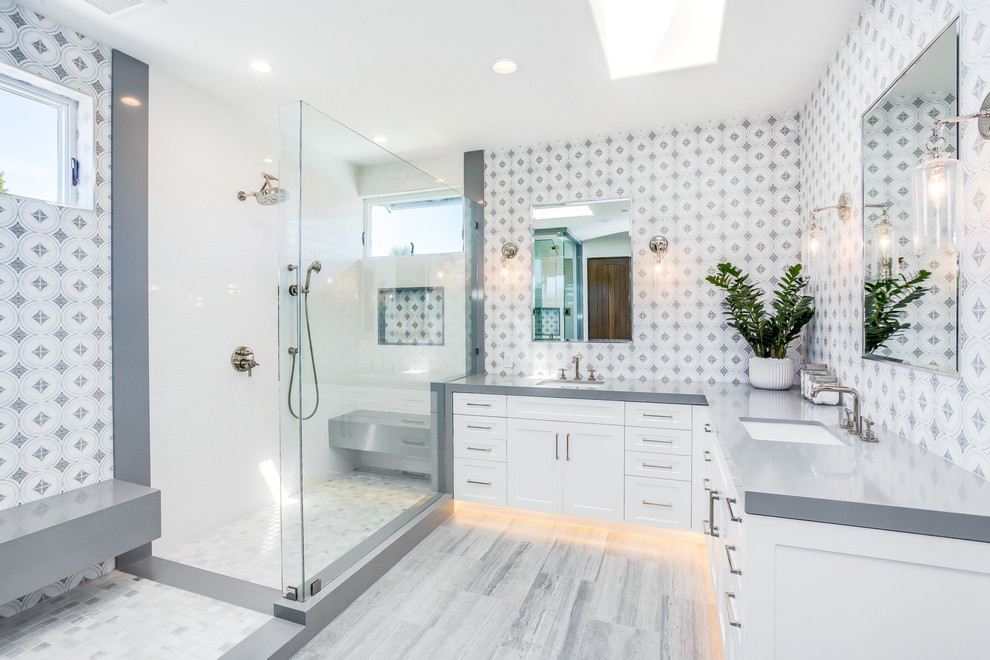 Inspiration for a mediterranean master bathroom in Orange County with shaker cabinets, white cabinets, a corner shower, gray tile, an undermount sink, grey floor, an open shower and grey benchtops.