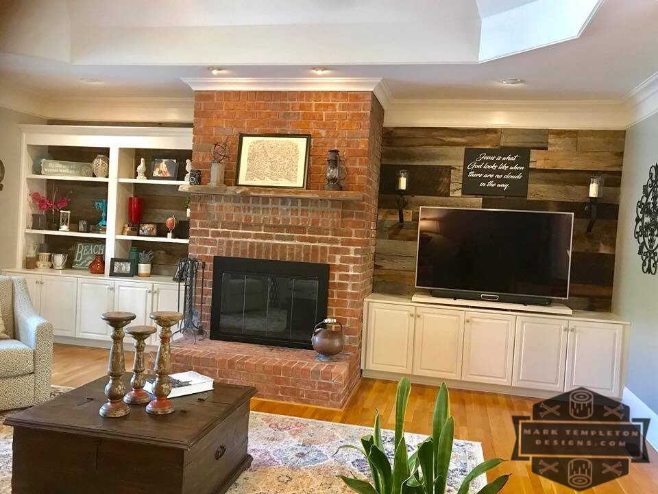 Photo of a mid-sized country formal enclosed living room in Nashville with grey walls, light hardwood floors, a standard fireplace, a brick fireplace surround, a freestanding tv and brown floor.