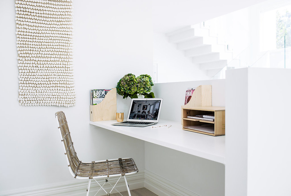 This is an example of a beach style home office in Sydney.