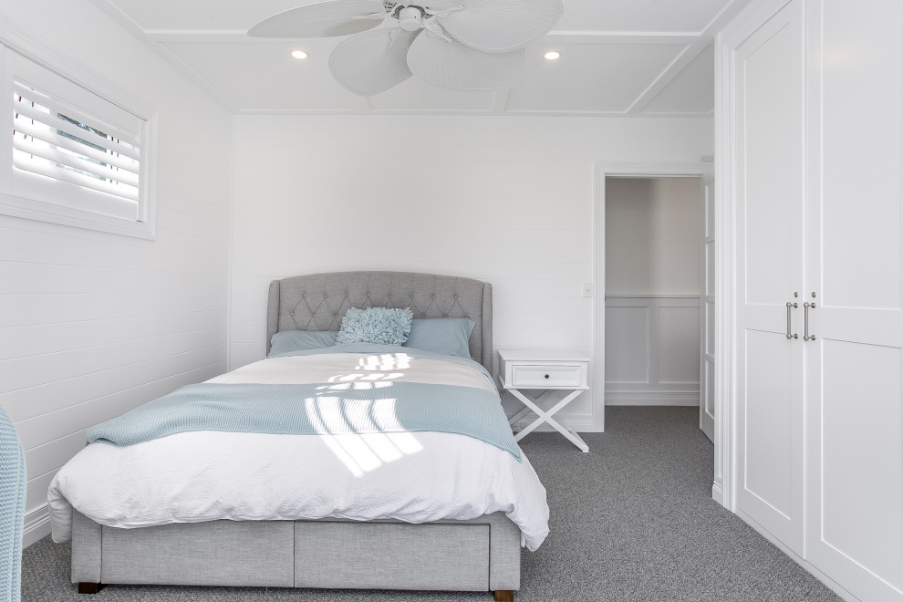 Design ideas for a beach style bedroom in Sydney.