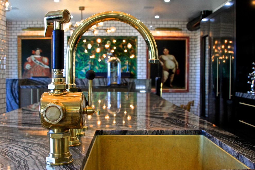 Example of a huge eclectic l-shaped ceramic tile enclosed kitchen design in Orange County with an undermount sink, flat-panel cabinets, gray cabinets, marble countertops, white backsplash, subway tile backsplash, black appliances and an island