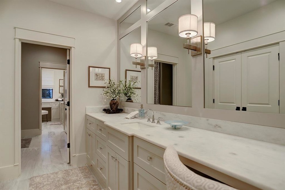 Design ideas for a large traditional 3/4 bathroom in Houston with shaker cabinets, a two-piece toilet, white walls, an undermount sink, engineered quartz benchtops, white benchtops, grey floor, white cabinets, an alcove shower, porcelain floors and a shower curtain.